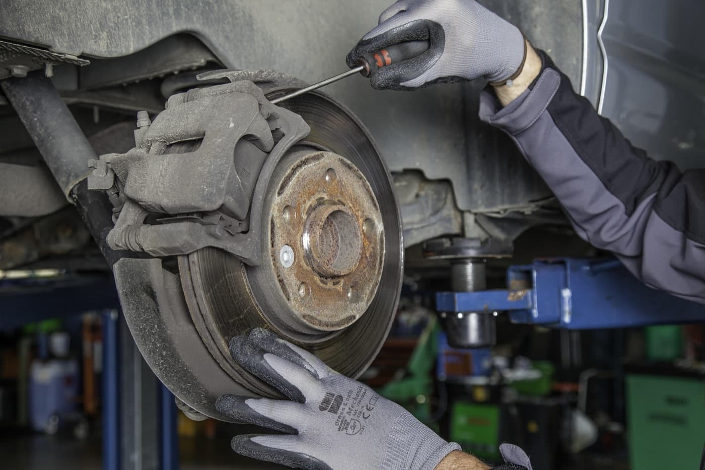 Mechanic performing brake work